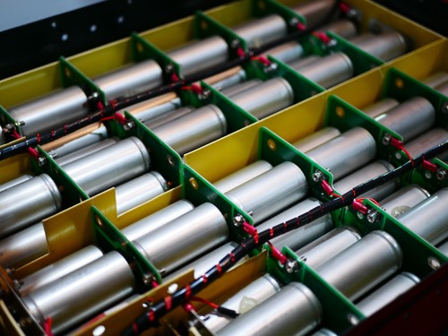 Lithium-ion batteries are connected to the electric circuit of an electric vehicle.